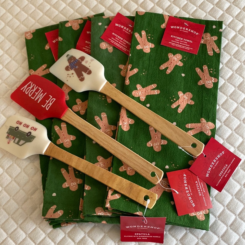 4 Christmas kitchen towels,  3 spatulas and 2 cookie cutters.